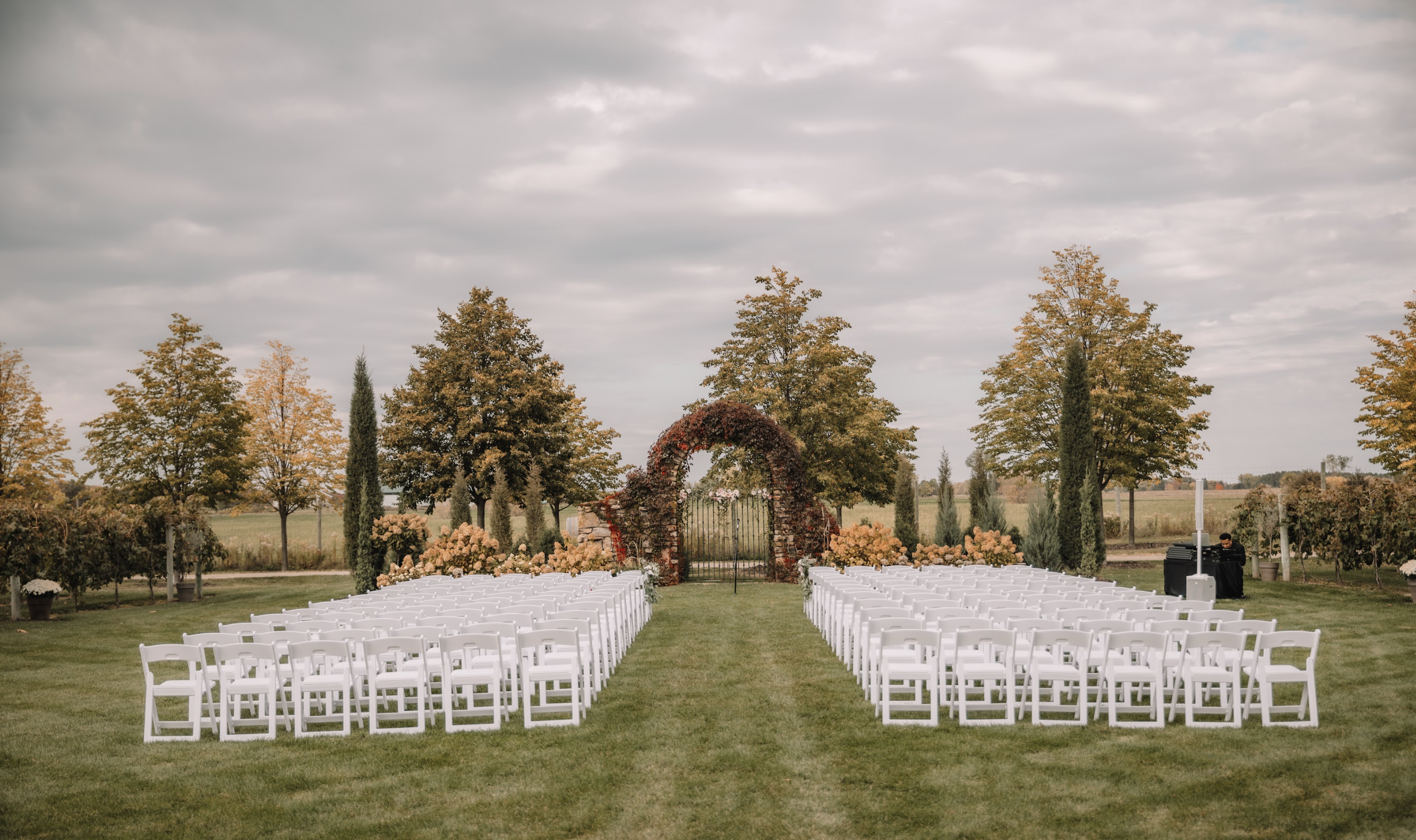 Outdoor ceremony spot in between a vineyard lawn at The Redeemed Farm wedding venue in Minnesota